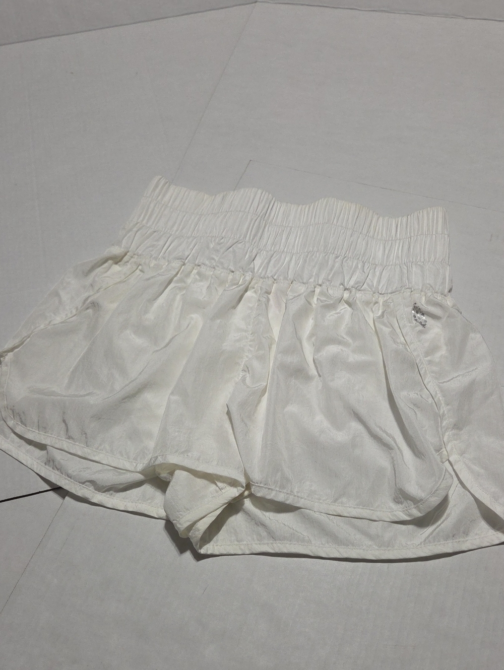 FP Movement by Free People Ivory Smocked High-Waist Ruffle Shorts
